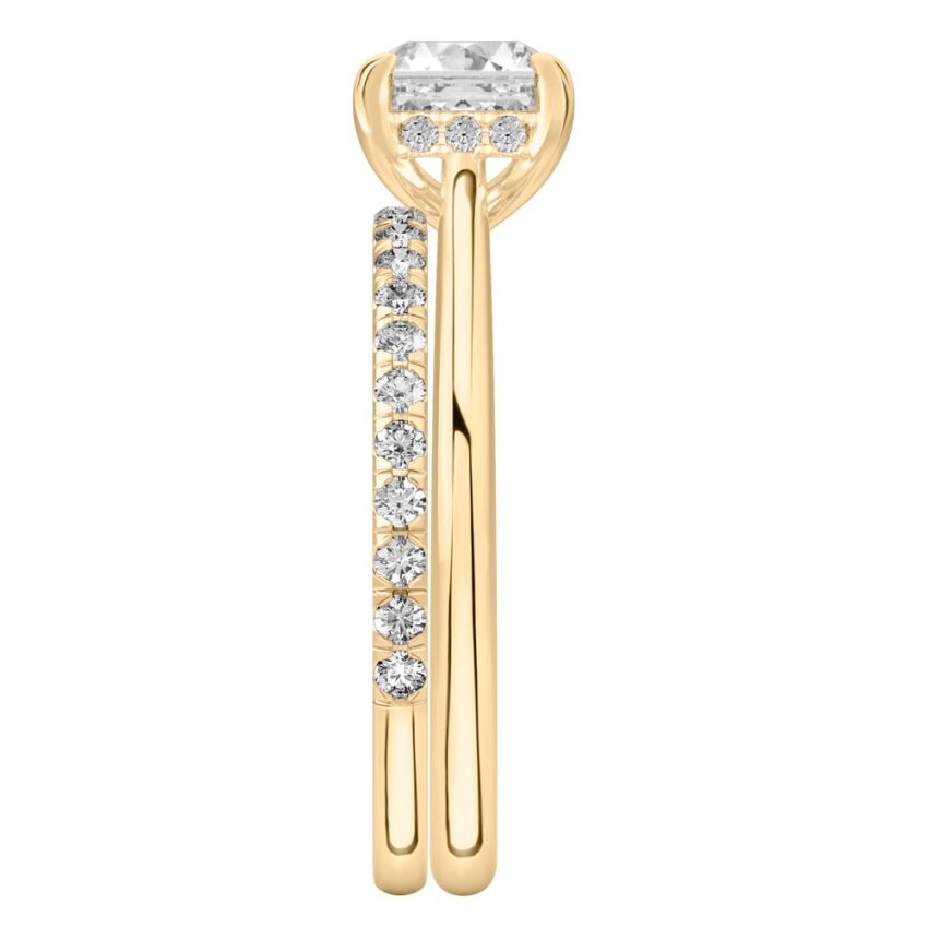 Side view of asscher cut diamond pave bridge engagement ring set yellow gold