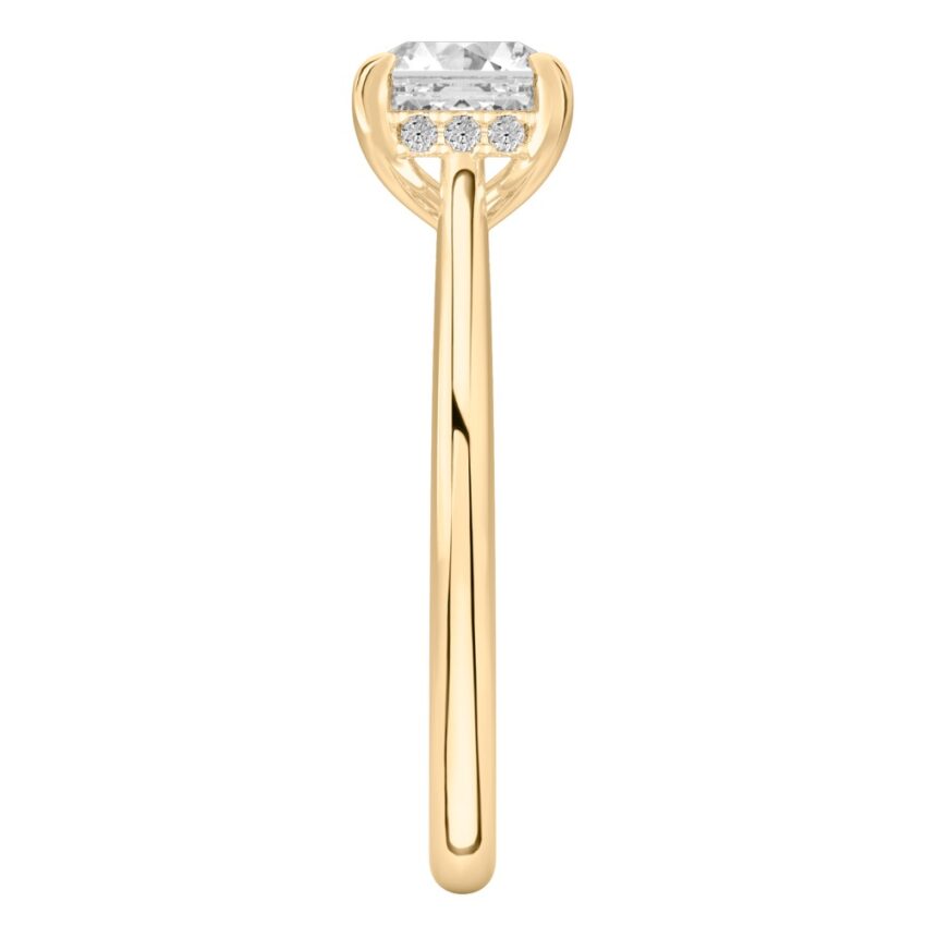 Side view of asscher cut diamond pave bridge engagement ring in yellow gold