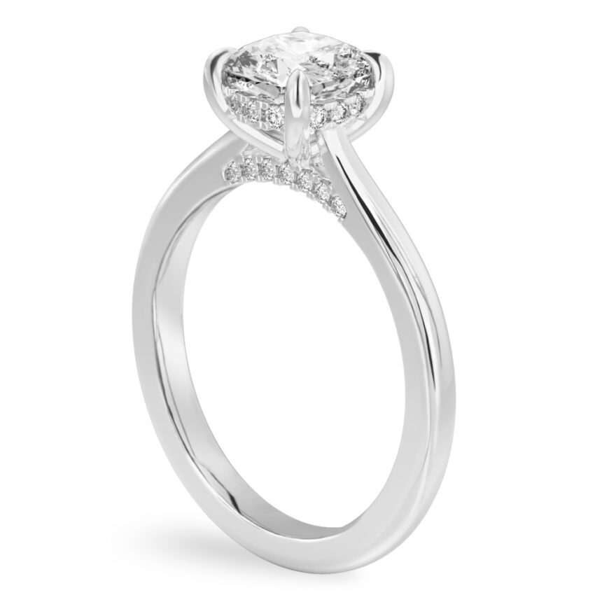 Angle view of cushion cut diamond pave bridge engagement ring in platinum