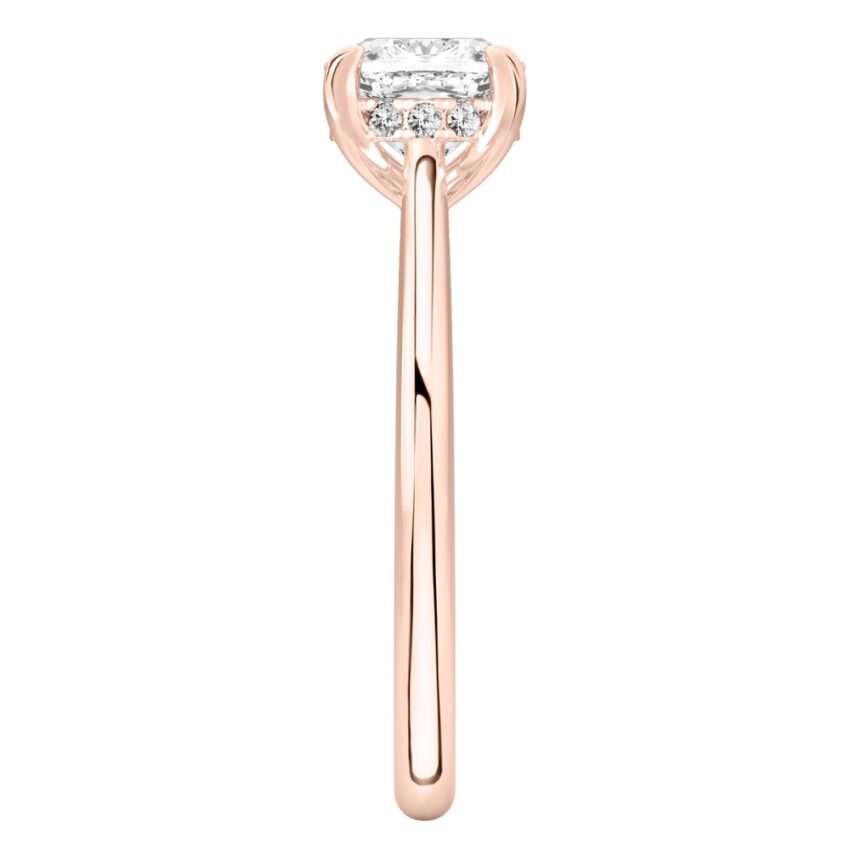Side view of cushion cut diamond pave bridge engagement ring in rose gold