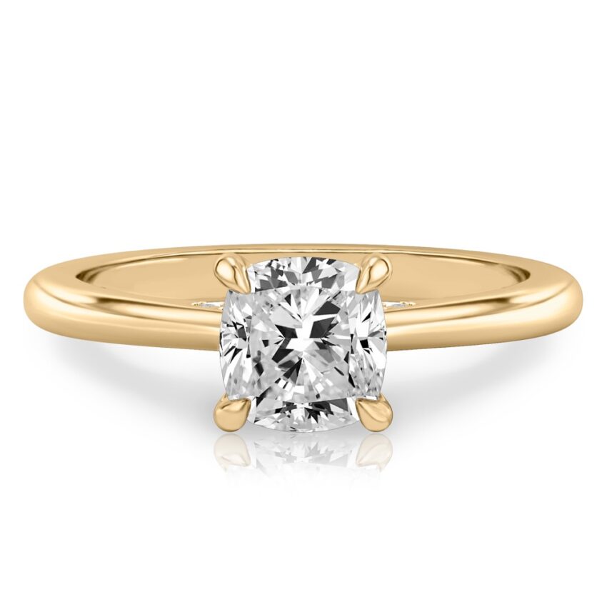 cushion cut diamond pave bridge engagement ring in yellow gold