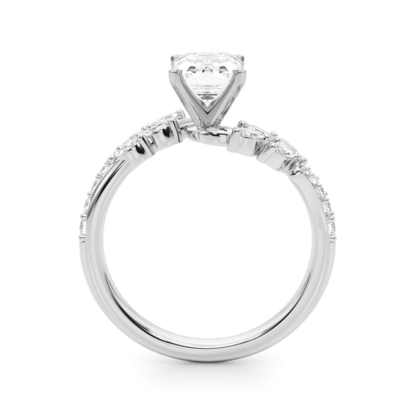 Side view of emerald cut diamond bypass nature inspired engagement ring in platinum