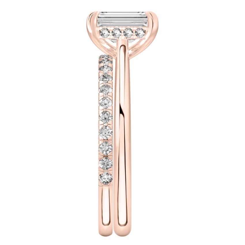 Side view of emerald cut diamond pave bridge engagement ring set rose gold