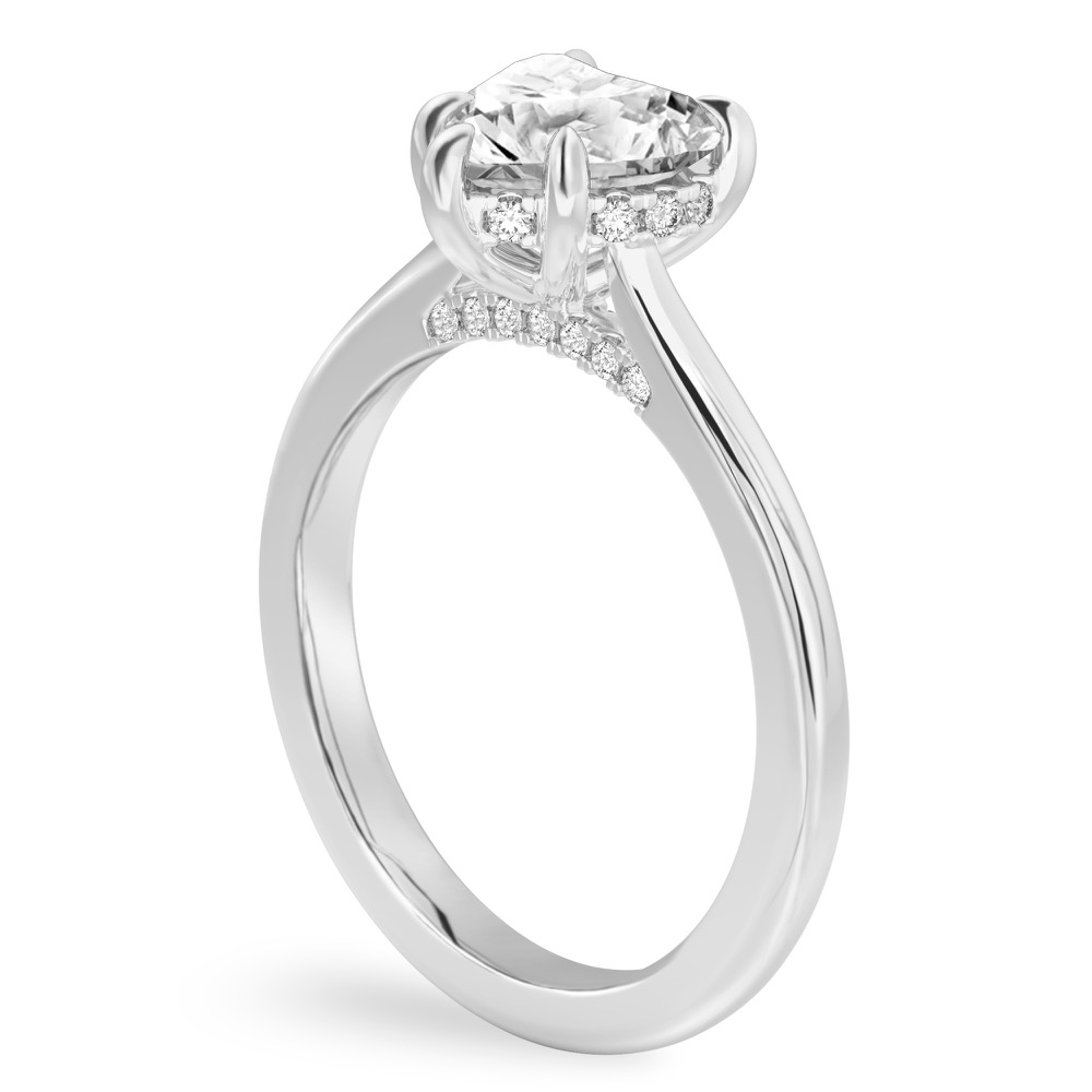 Angle view of heart shape diamond pave bridge engagement ring in platinum