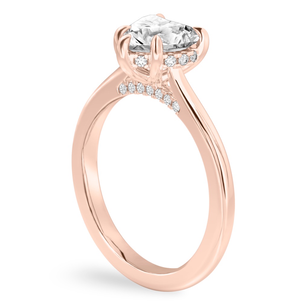 Angle view of heart shape diamond pave bridge engagement ring in rose gold