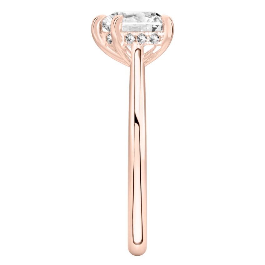 Side view of heart shape diamond pave bridge engagement ring in rose gold