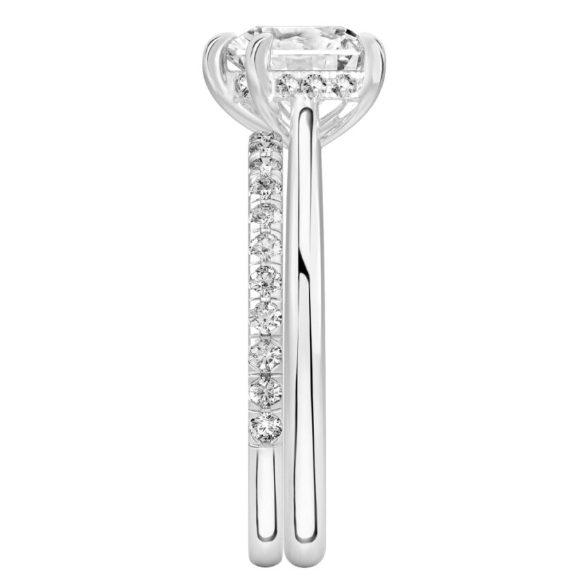 Side view of heart shape diamond pave bridge engagement ring set white gold