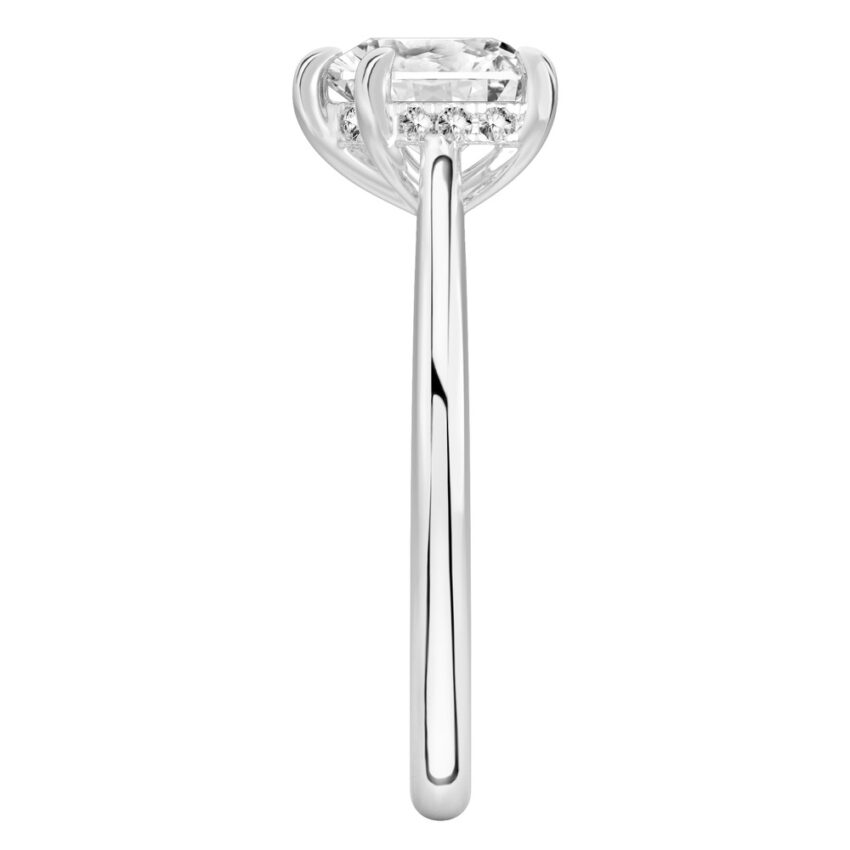 Side view of heart shape diamond pave bridge engagement ring in white gold