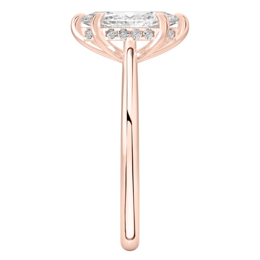 Side view of marquise cut diamond pave bridge engagement ring in rose gold
