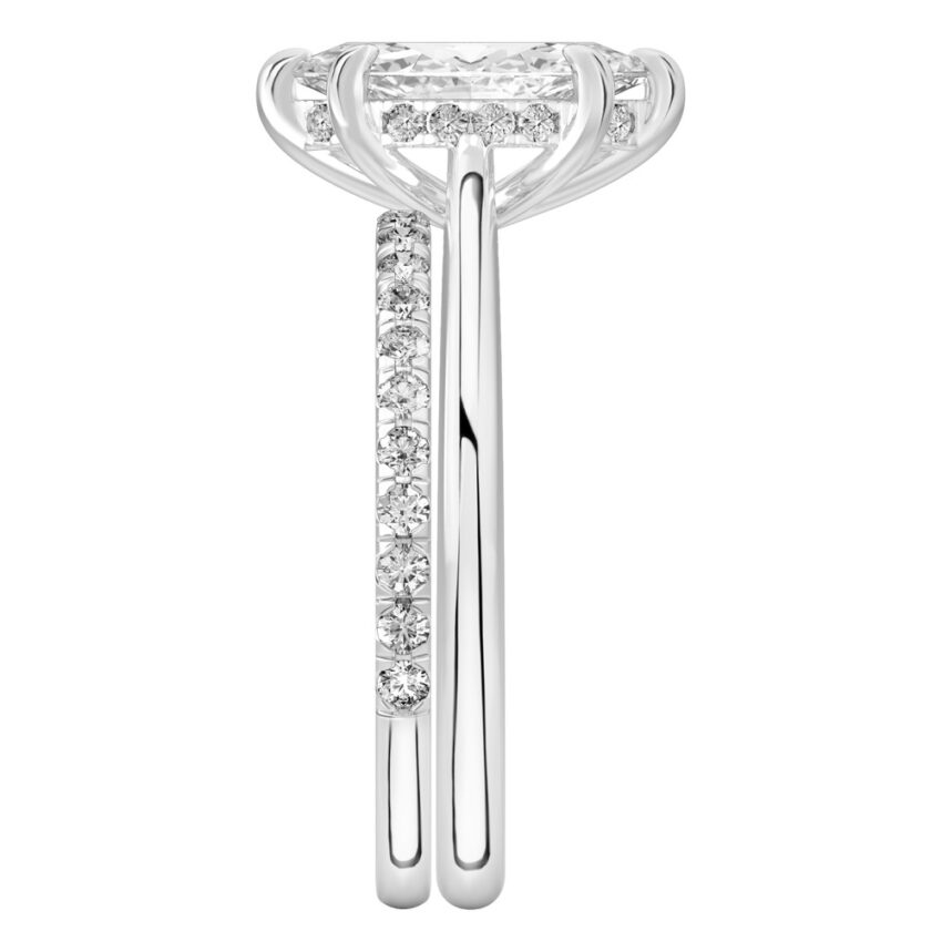 Side view of marquise cut diamond pave bridge engagement ring set platinum