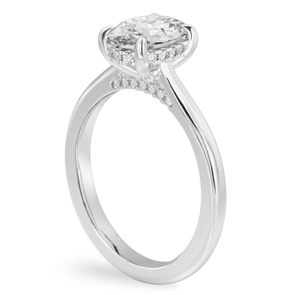 Angle view of oval cut diamond pave bridge engagement ring in palladium