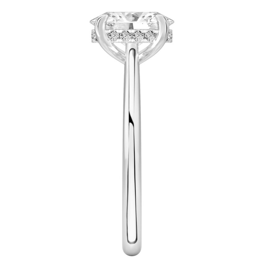 Side view of oval cut diamond pave bridge engagement ring in platinum