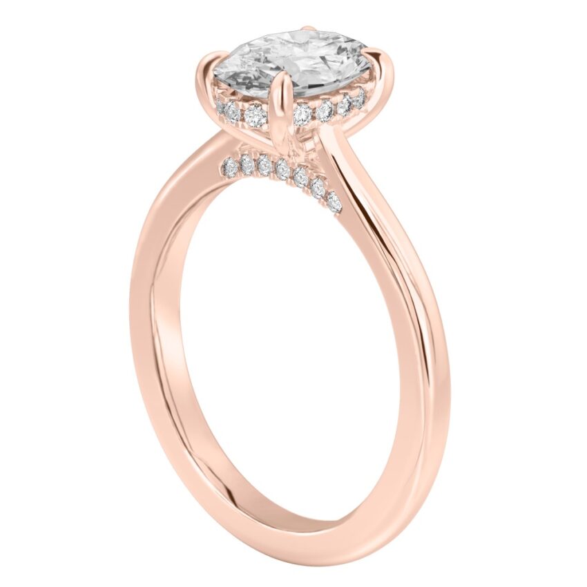 Angle view of oval cut diamond pave bridge engagement ring in rose gold