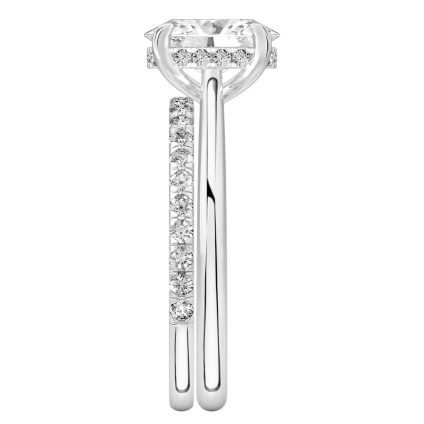 Side view of oval cut diamond pave bridge engagement ring set platinum