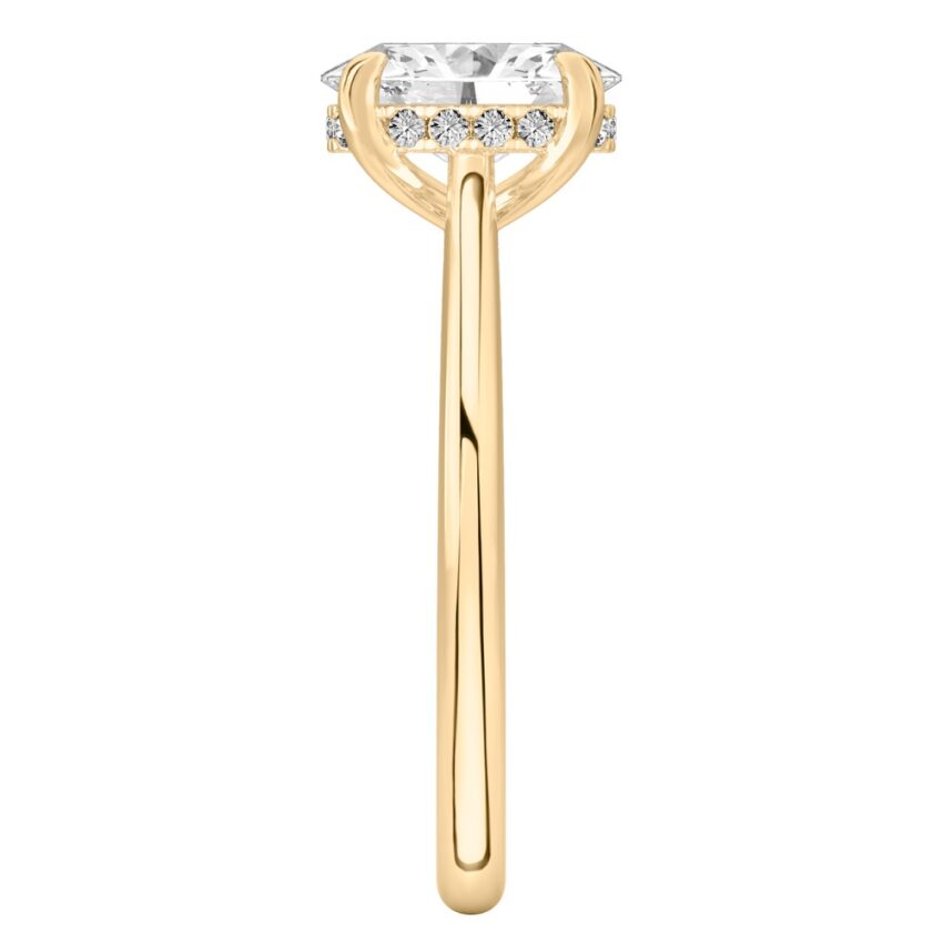 Side view of oval cut diamond pave bridge engagement ring in yellow gold