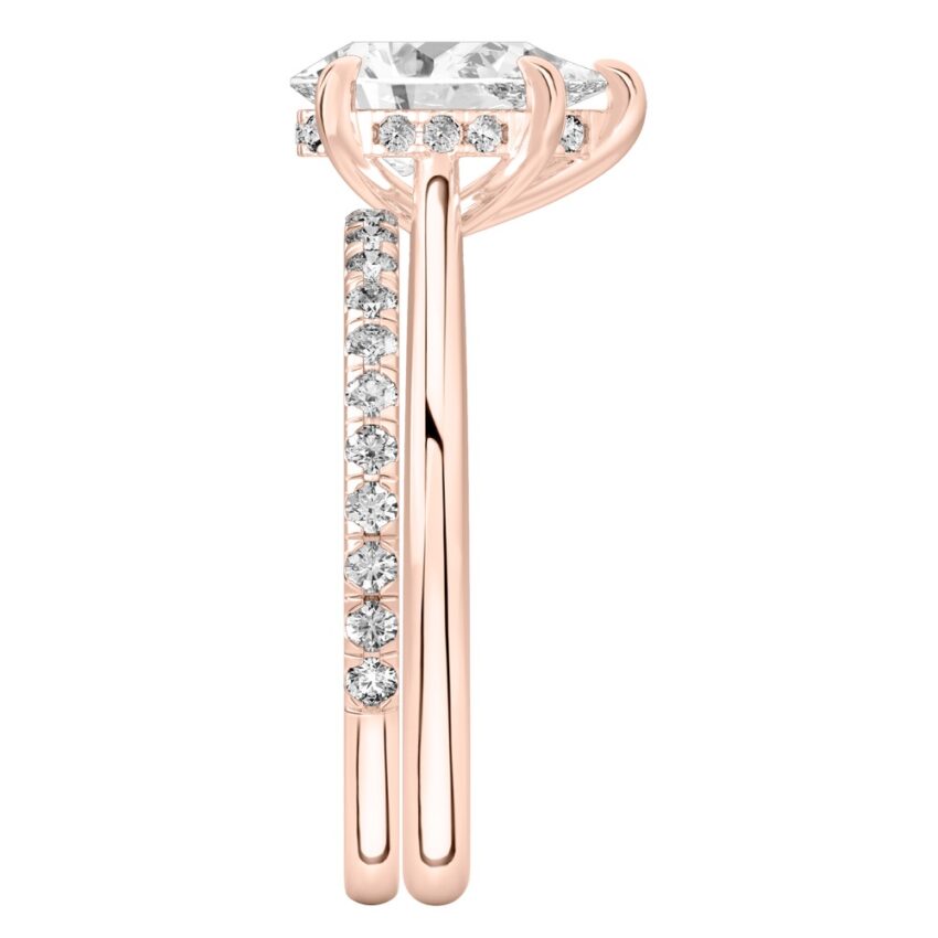 Side view of pear shape diamond pave bridge engagement ring set rose gold