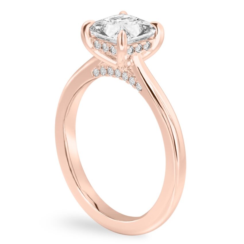 Angle view of princess cut diamond pave bridge engagement ring in rose gold