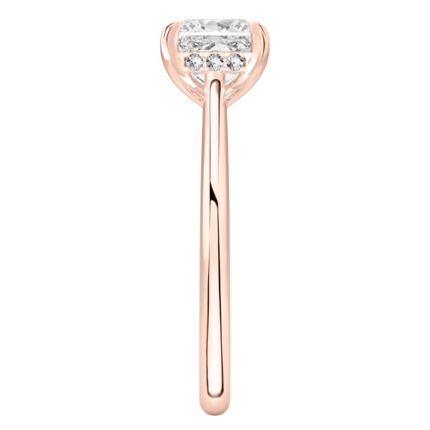Side view of princess cut diamond pave bridge engagement ring in rose gold