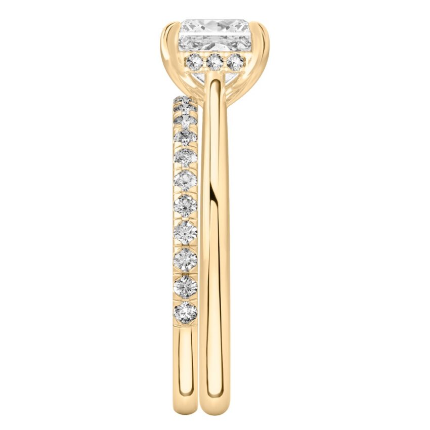 Side view of princess cut diamond pave bridge engagement ring set yellow gold