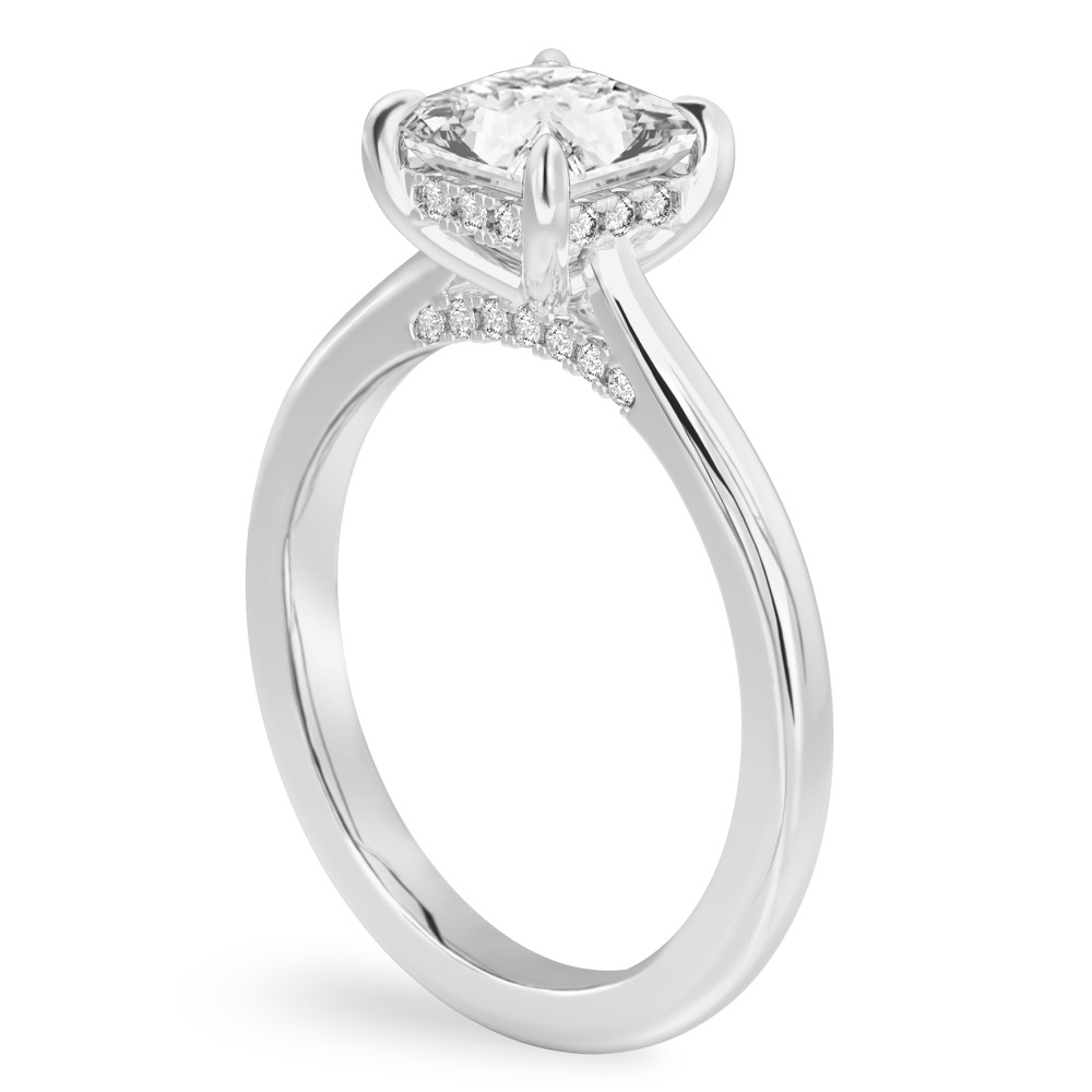 Angle view of princess cut diamond pave bridge engagement ring in white gold