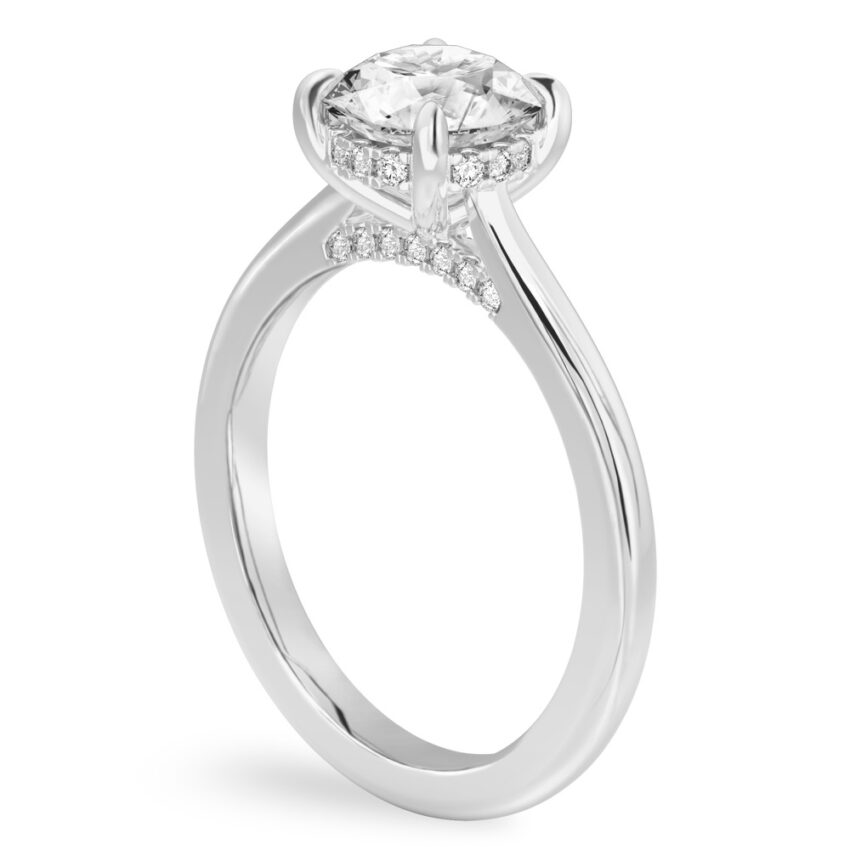 Angle view of round cut diamond pave bridge engagement ring in platinum
