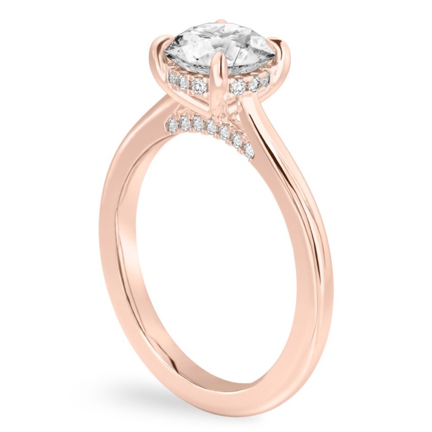 Angle view of round cut diamond pave bridge engagement ring in rose gold