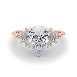 Side view of pear shape diamond nature inspired marquise stone engagement ring in rose gold