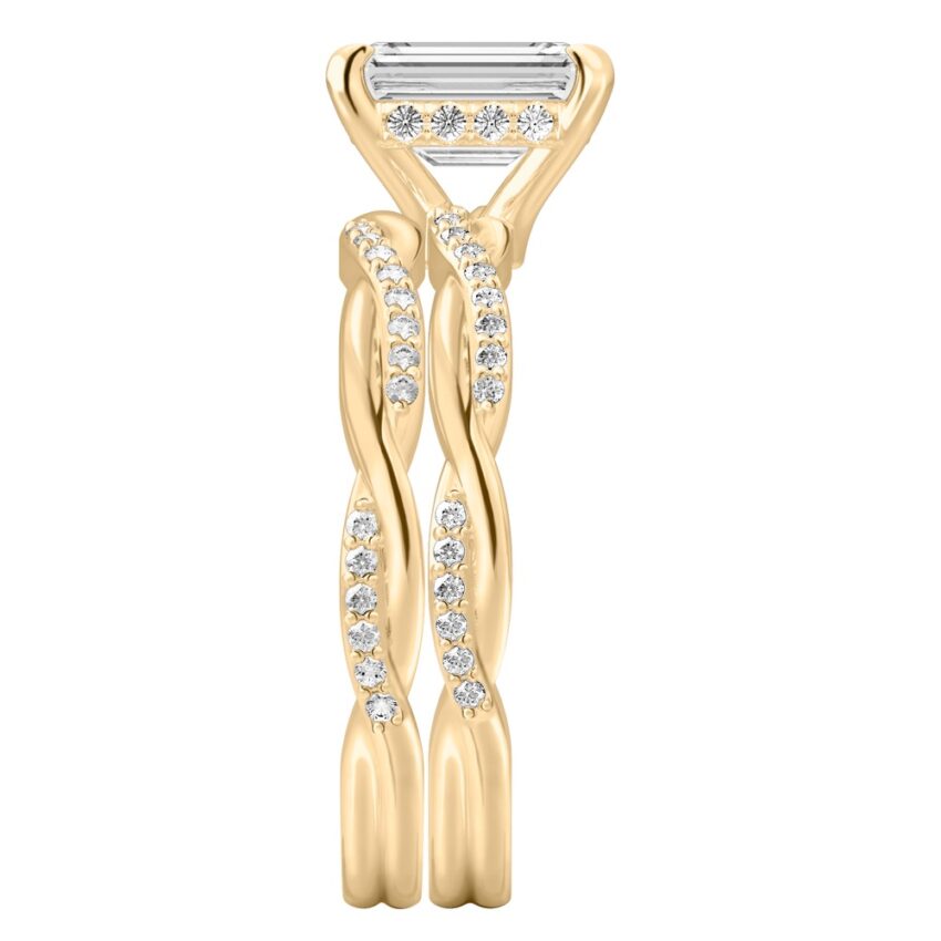 Side view of emerald cut diamond twist hidden halo engagement ring set yellow gold