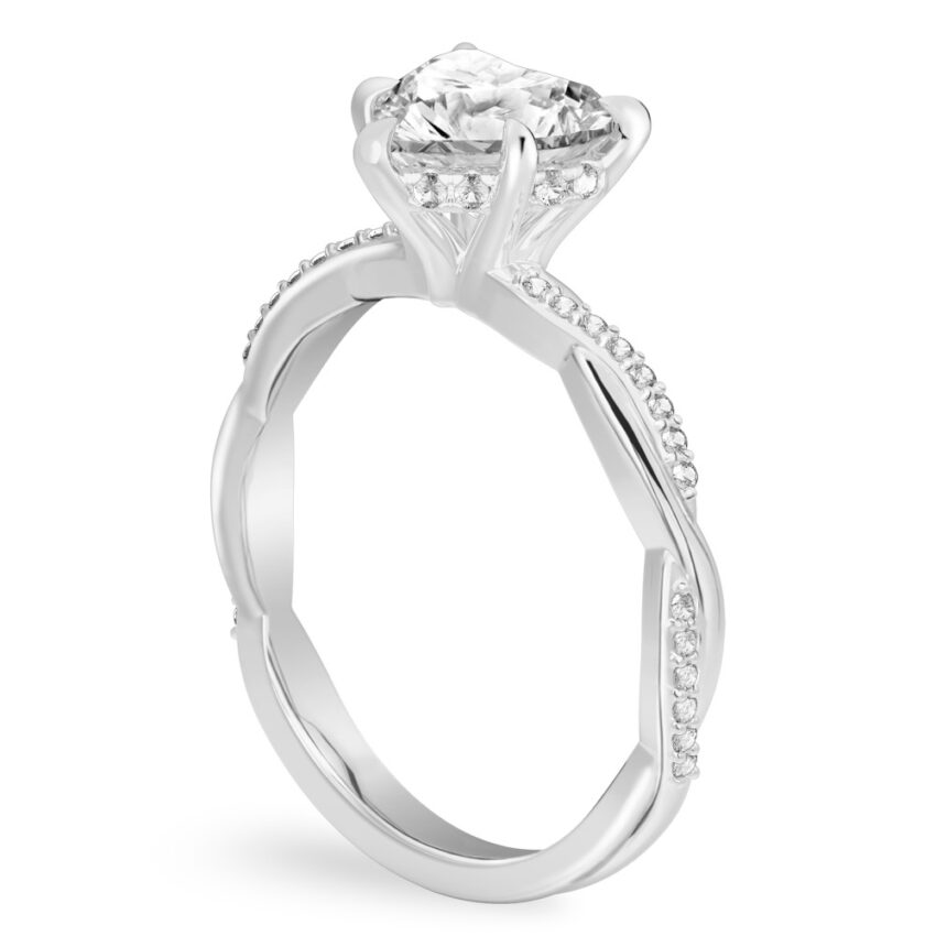 Angle view of heart shape diamond twist hidden halo engagement ring in platinum