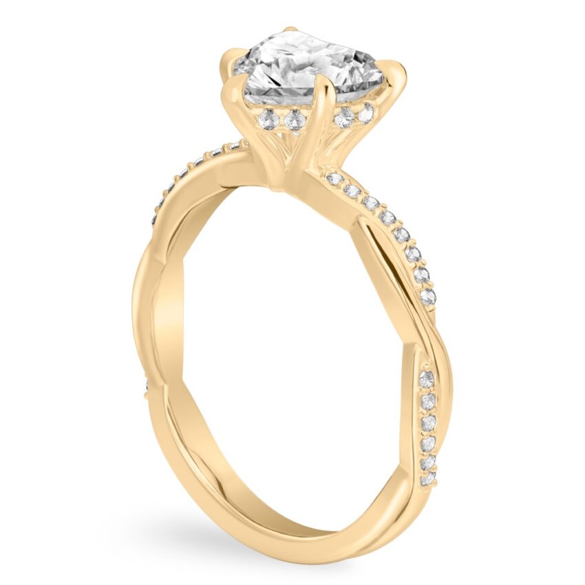 Angle view of heart shape diamond twist hidden halo engagement ring in yellow gold
