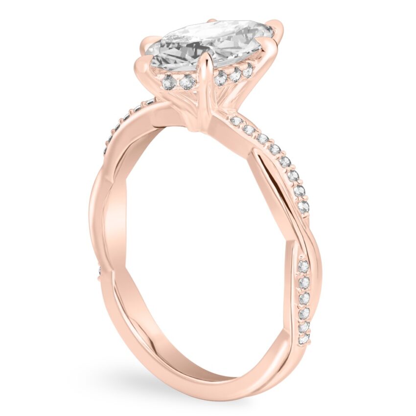 Angle view of marquise cut diamond twist hidden halo engagement ring in rose gold