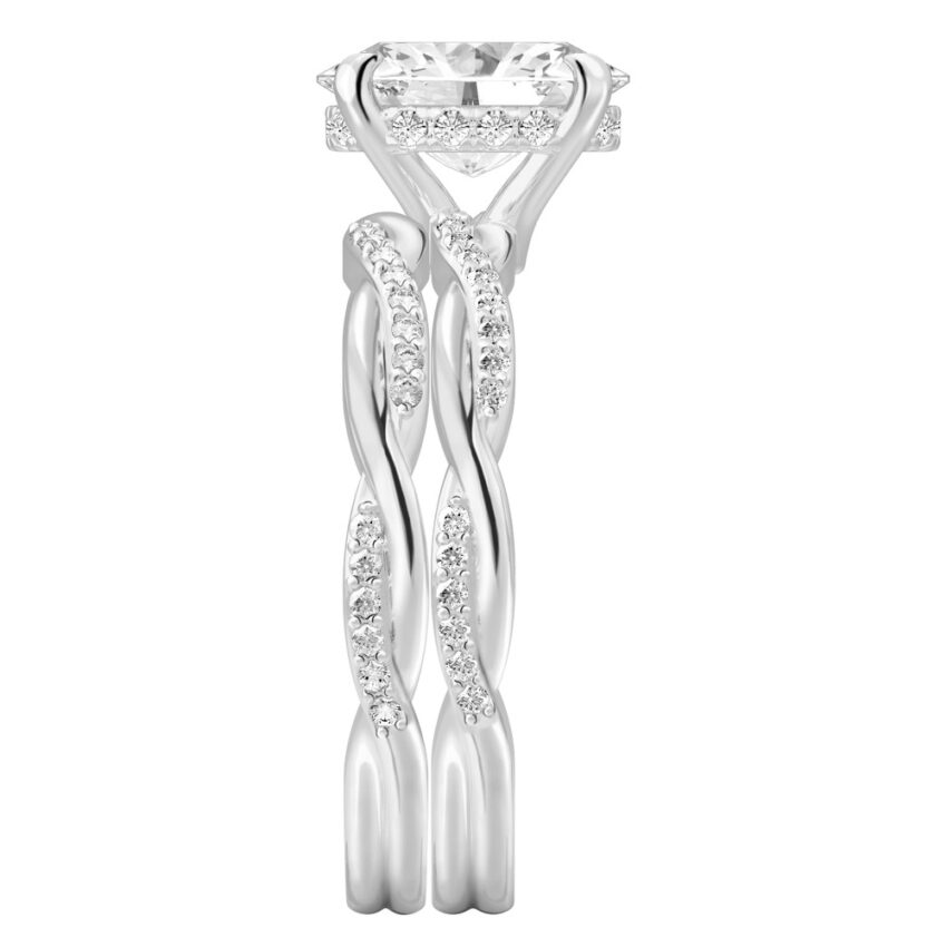 Side view of oval cut diamond twist hidden halo engagement ring set palladium