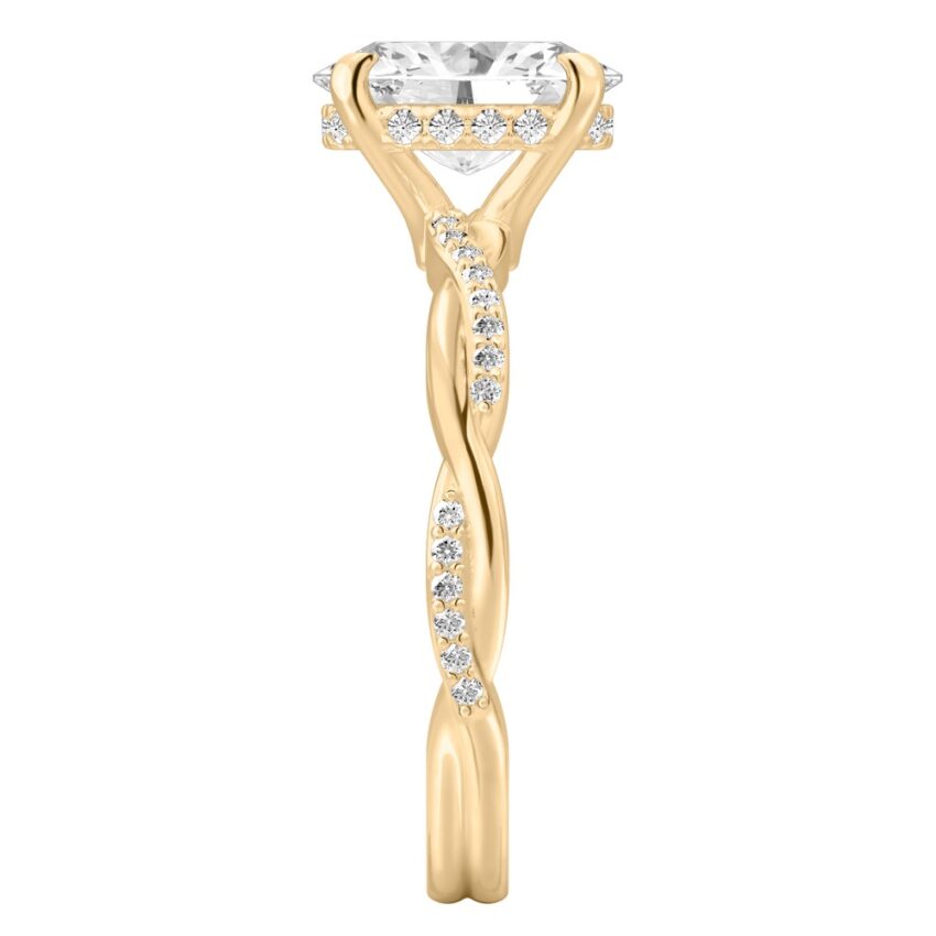 Side view of oval cut diamond twist hidden halo engagement ring in yellow gold