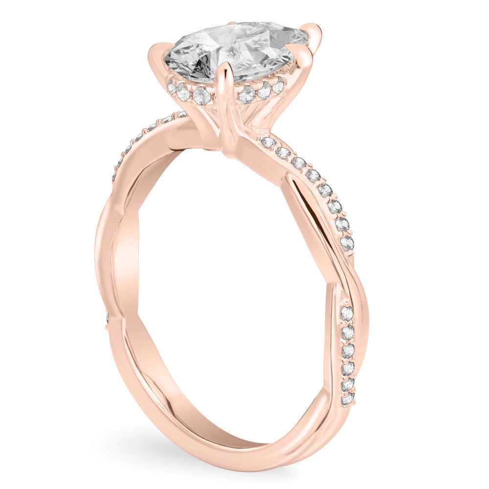 Angle view of pear shape diamond twist hidden halo engagement ring in rose gold