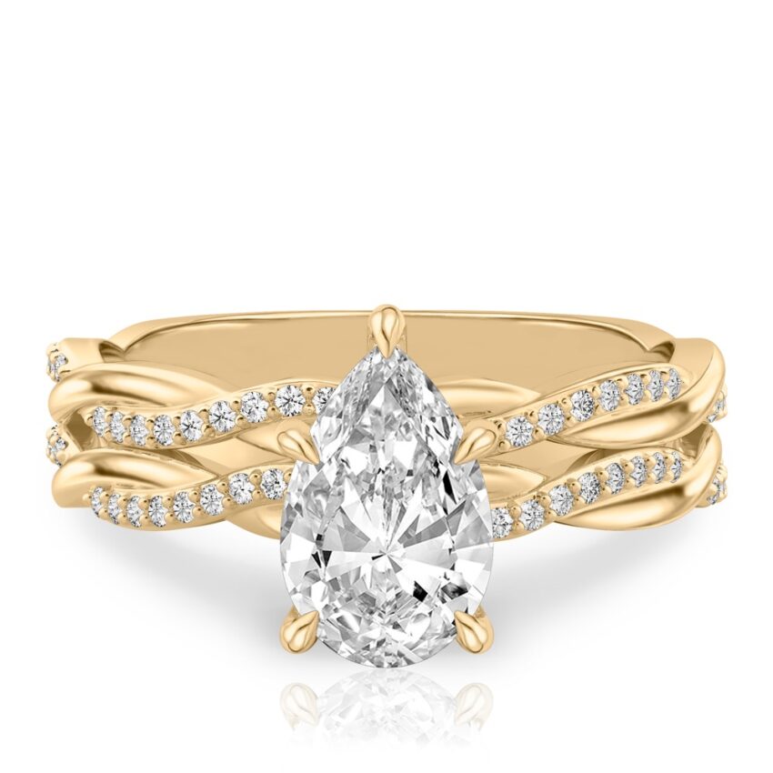 pear shape diamond twist hidden halo engagement ring set yellow gold