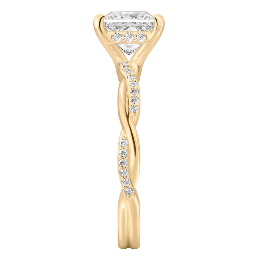 Side view of princess cut diamond twist hidden halo engagement ring in yellow gold