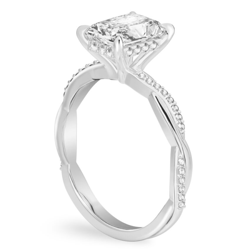 Angle view of radiant cut diamond twist hidden halo engagement ring in platinum