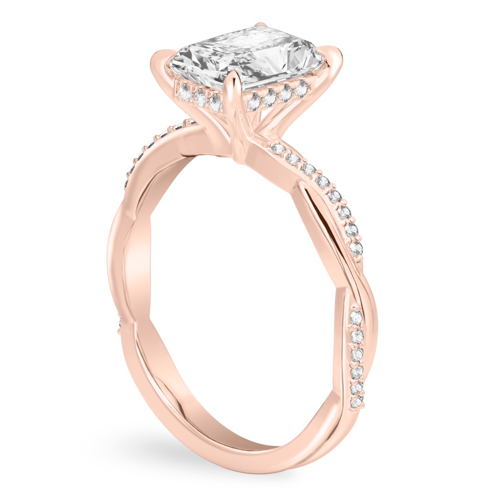 Angle view of radiant cut diamond twist hidden halo engagement ring in rose gold
