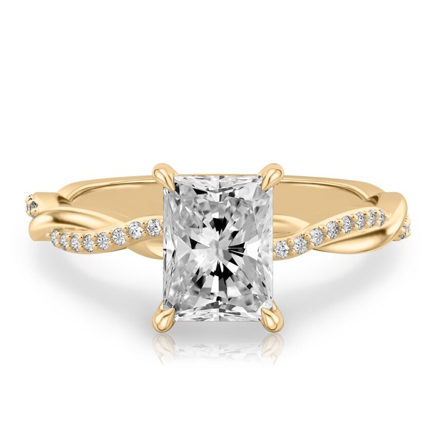 radiant cut diamond twist hidden halo engagement ring in yellow gold