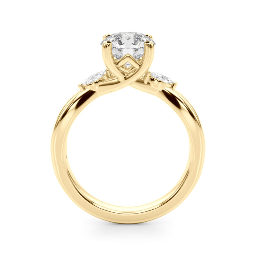 Side view of round cut diamond nature inspired crossover engagement ring in yellow gold