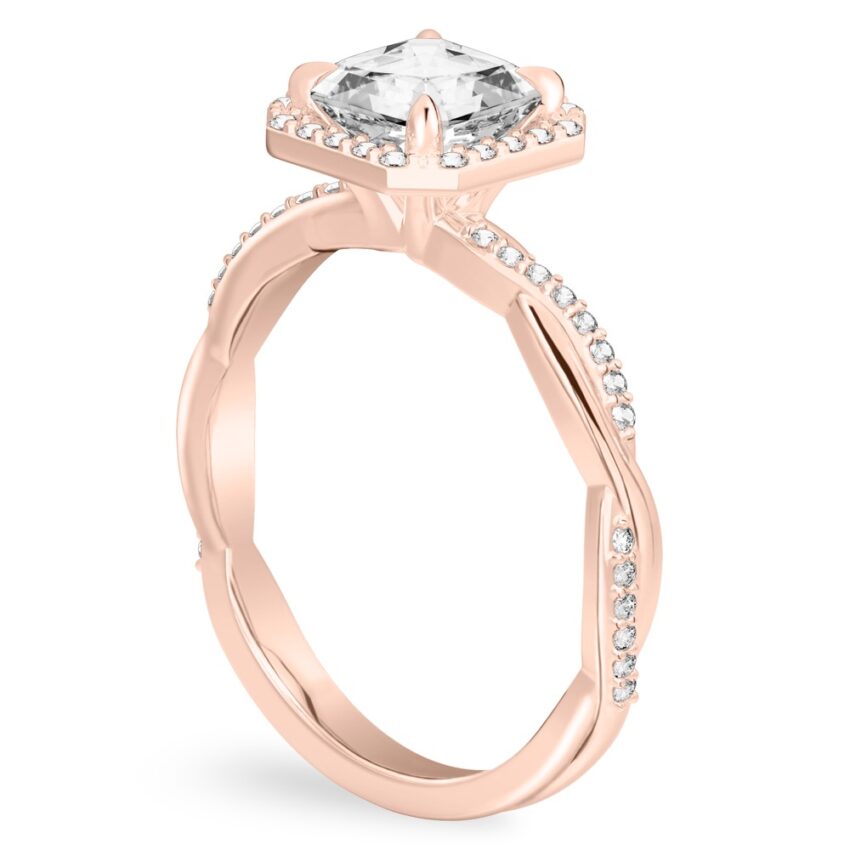 Angle view of asscher cut diamond twist halo engagement ring in rose gold