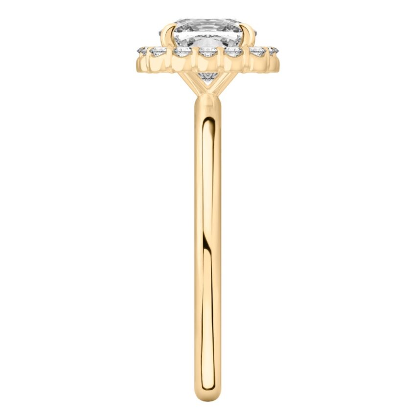 Side view of cushion cut diamond floral halo engagement ring in yellow gold