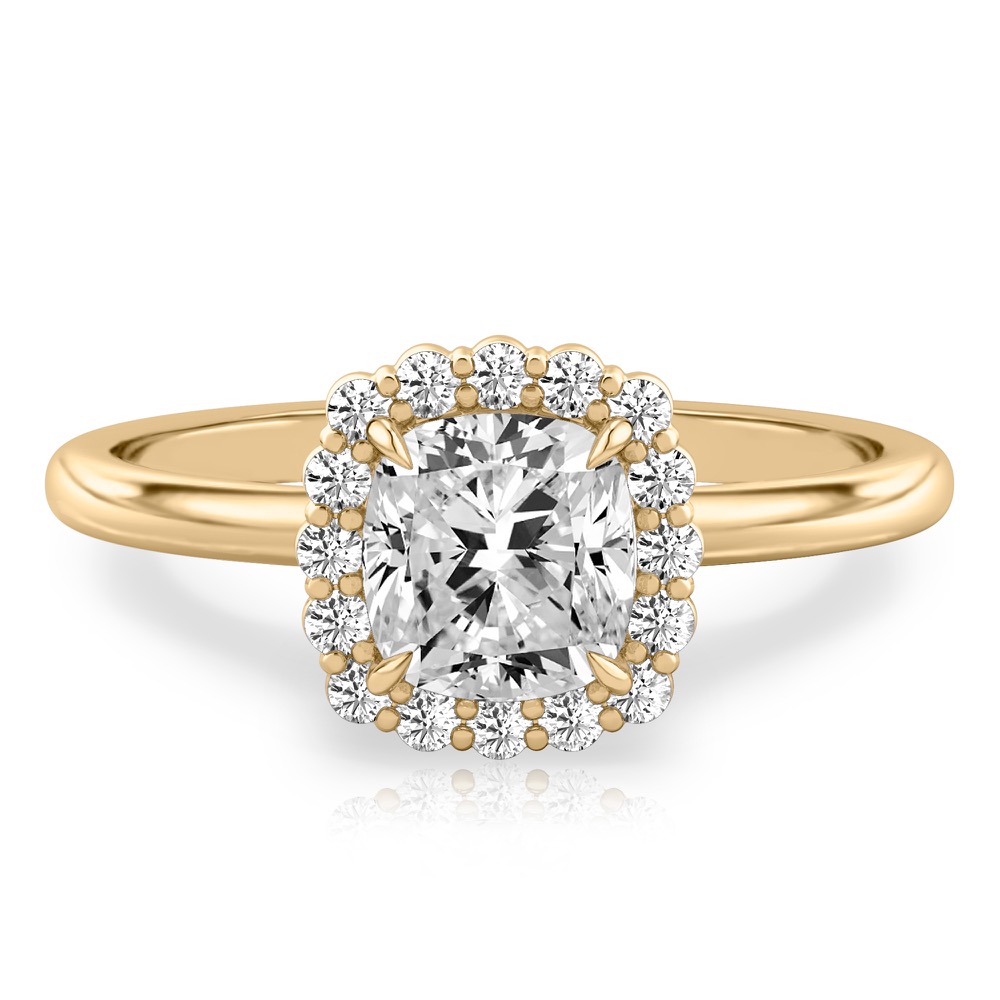 cushion cut diamond floral halo engagement ring in yellow gold