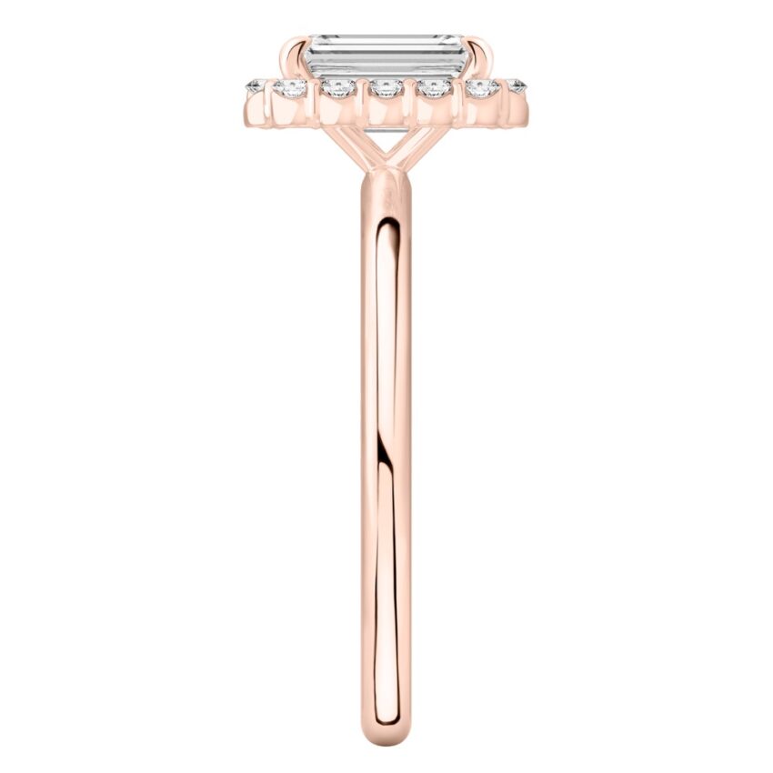 Side view of emerald cut diamond floral halo engagement ring in rose gold