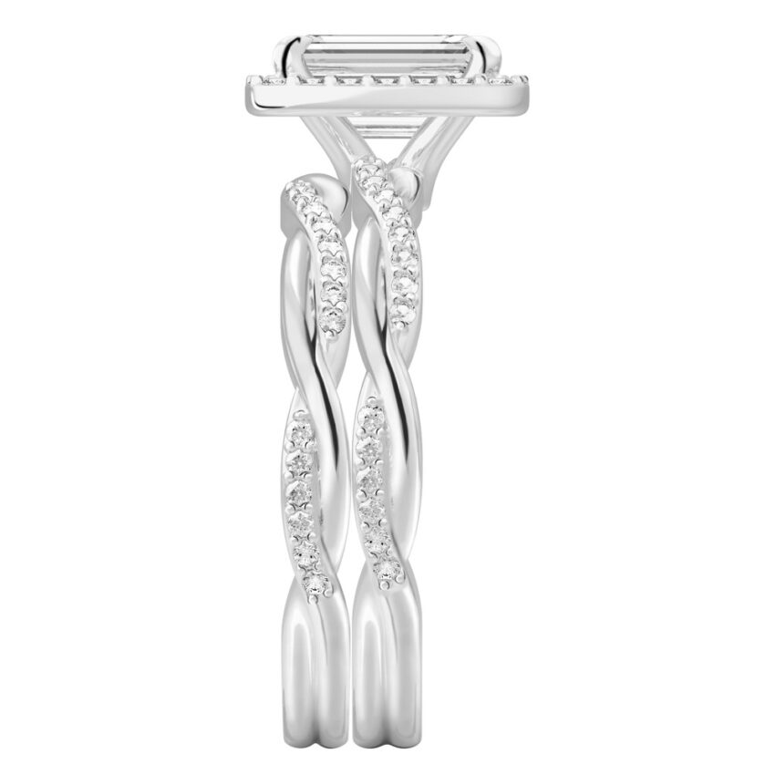 Side view of emerald cut diamond twist halo engagement ring set platinum