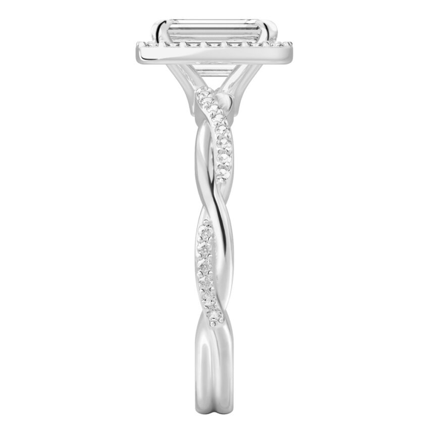 Side view of emerald cut diamond twist halo engagement ring in white gold