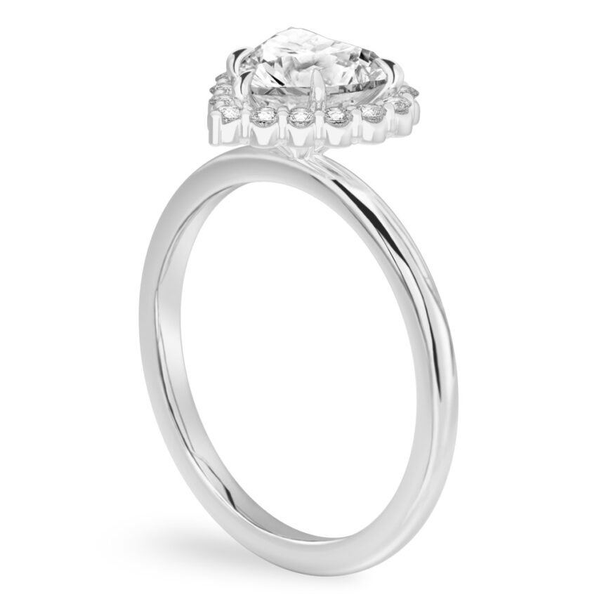 Angle view of heart shape diamond floral halo engagement ring in platinum