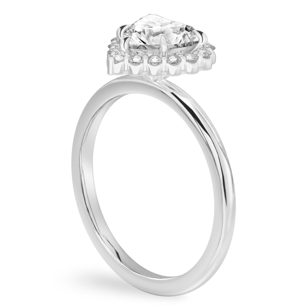 Angle view of heart shape diamond floral halo engagement ring in platinum
