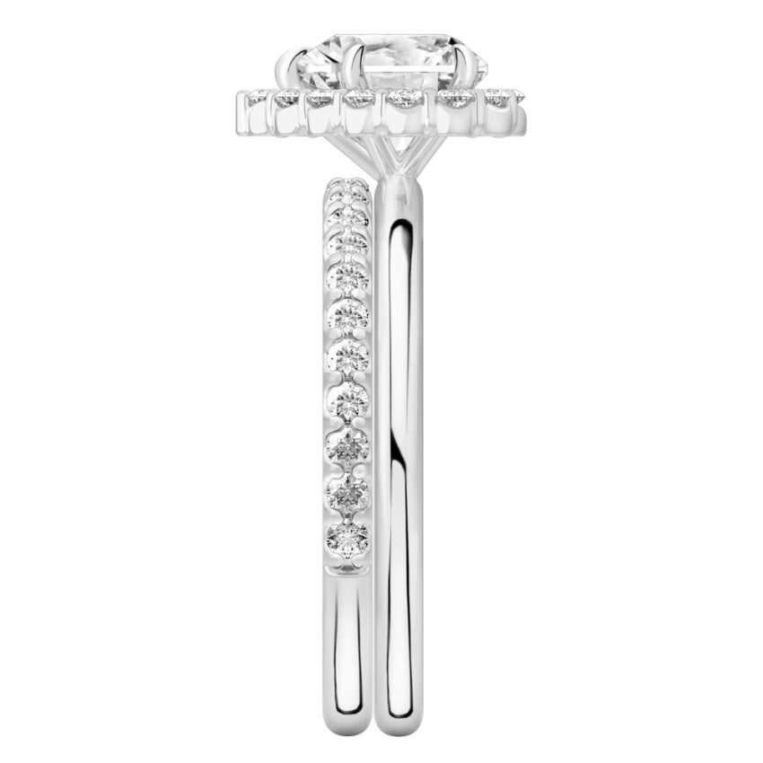 Side view of heart shape diamond floral halo engagement ring set platinum