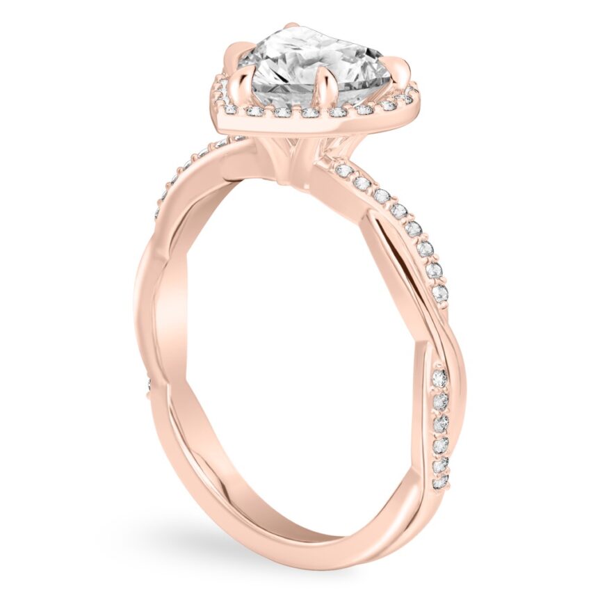 Angle view of heart shape diamond twist halo engagement ring in rose gold